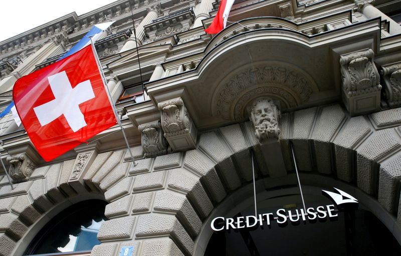 &copy; Reuters. FILE PHOTO: Switzerland's national flag flies below a logo of Swiss bank Credit Suisse at its headquarters at the Paradeplatz square in Zurich, July 31, 2019.  REUTERS/Arnd Wiegmann/File Photo/File Photo