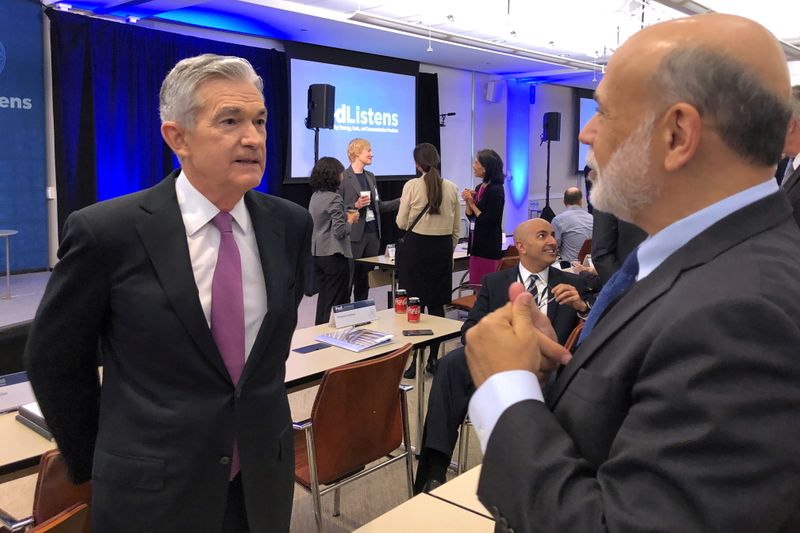 &copy; Reuters. FILE PHOTO: Federal Reserve Chair Jerome Powell (L) speaks with former Fed Chairman Ben Bernanke at a conference on monetary policy at the Federal Reserve Bank of Chicago, part of a 'Fed Listens' series as the U.S. central bank rethinks its long term stra