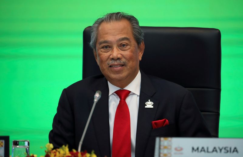 &copy; Reuters. FILE PHOTO: Malaysia's Prime Minister Muhyiddin Yassin speaks during opening remarks for virtual APEC Economic Leaders Meeting 2020, in Kuala Lumpur, Malaysia November 20, 2020. REUTERS/Lim Huey Teng/File Photo