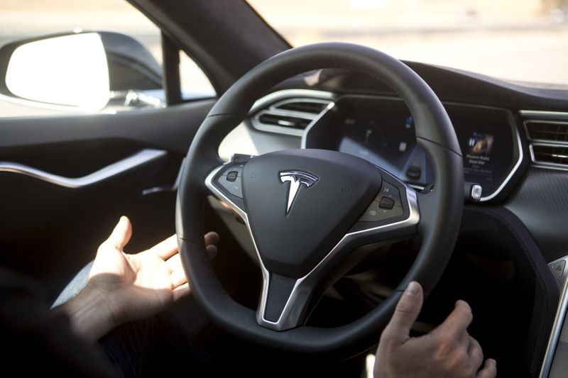 &copy; Reuters. FILE PHOTO: New Autopilot features are demonstrated in a Tesla Model S during a Tesla event in Palo Alto, California October 14, 2015. REUTERS/Beck Diefenbach