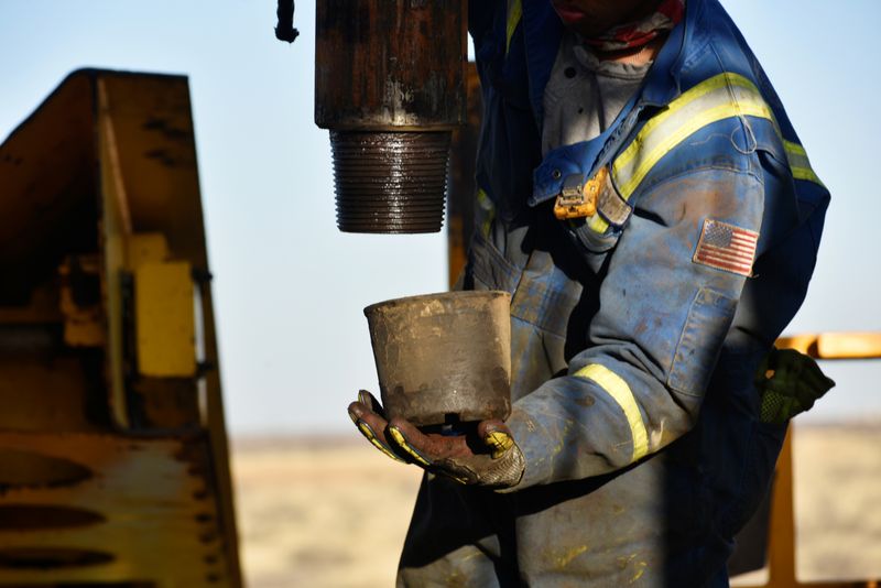 &copy; Reuters. An oil worker removes a thread cap from a piece of drill pipe on a drilling lease owned by Elevation Resources near Midland, Texas, U.S., February 12, 2019. REUTERS/Nick Oxford/Files