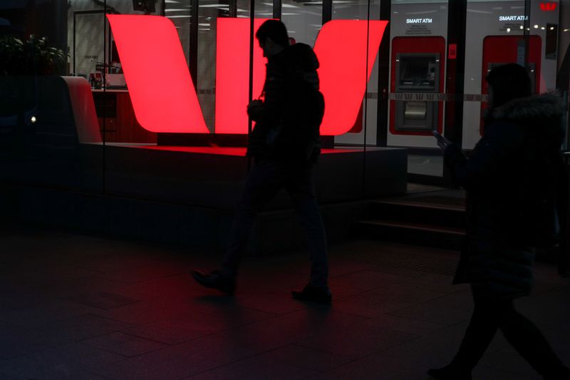 &copy; Reuters. Pedestrians walk past the ground floor of an office building with Westpac logo amidst the easing of the coronavirus disease (COVID-19) restrictions in the Central Business District of Sydney, Australia, June 3, 2020. REUTERS/Loren Elliott/Files