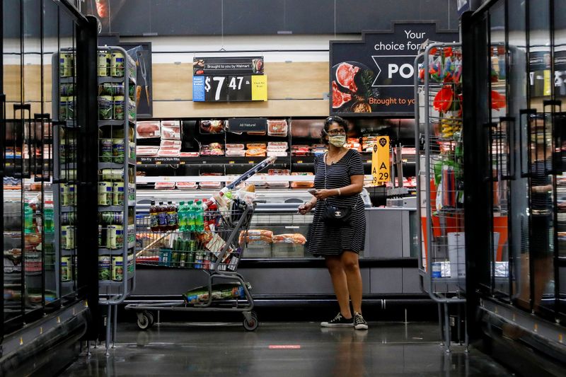 &copy; Reuters. FILE PHOTO: A shopper is seen wearing a mask while shopping at a Walmart store in Bradford, Pennsylvania, U.S. July 20, 2020. REUTERS/Brendan McDermid/File Photo