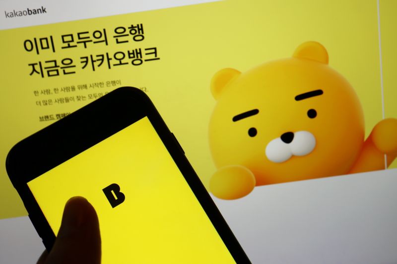 &copy; Reuters. FILE PHOTO: Digital lender Kakao Bank Corp made a stunning debut in Seoul earlier this month, becoming South Korea's biggest financial services firm by market value.The Kakao Bank app is seen on a mobile phone screen displayed in front of the lender's log