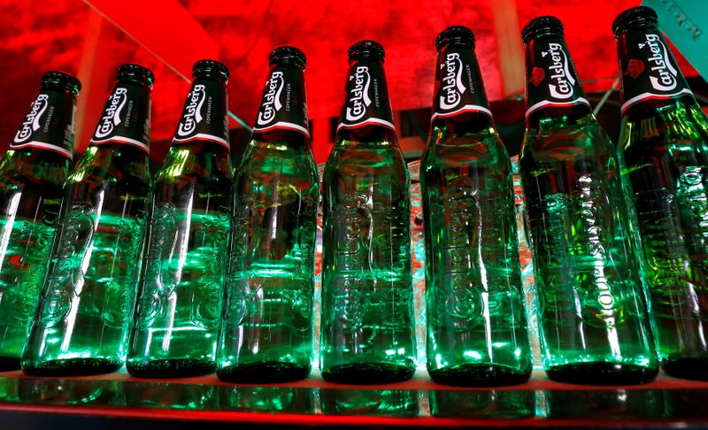 &copy; Reuters. FILE PHOTO: Bottles of Carlsberg beer are seen in a bar in St. Petersburg, Russia, June 17, 2014. REUTERS/Alexander Demianchuk/File Photo
