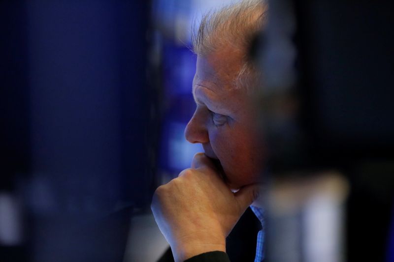 &copy; Reuters. A trader works on the trading floor of the New York Stock Exchange (NYSE) in Manhattan, New York City, U.S., August 17, 2021. REUTERS/Andrew Kelly
