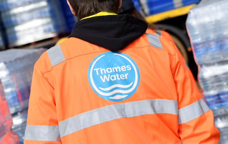 &copy; Reuters. FILE PHOTO: A Thames Water operative views pallets of bottled water for distribution in Hampstead in London, Britain, March 5, 2018.  REUTERS/Toby Melville