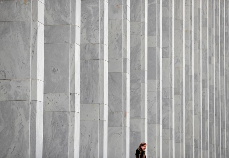 &copy; Reuters. FILE PHOTO: A woman speaks on her phone in front of The Library of Congress John Adams Building in Washington, U.S., November 18, 2019. REUTERS/Yara Nardi    
