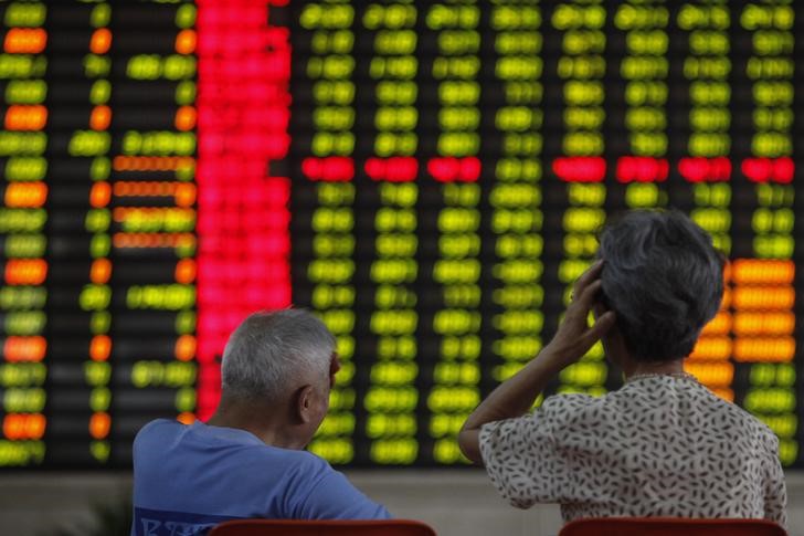 &copy; Reuters. Investors sit in front of an electronic board showing stock information at a brokerage house in Shanghai June 25, 2013. China shares pared hefty losses after earlier testing 4-1/2-year lows on Tuesday ahead of a press conference in Shanghai at which trade