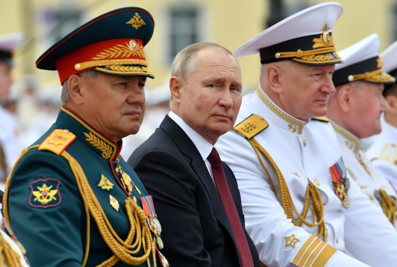 &copy; Reuters. FILE PHOTO: Russia's President Vladimir Putin, Defence Minister Sergei Shoigu and Commander-in-Chief of the Russian Navy Nikolai Yevmenov attend the Navy Day parade in Saint Petersburg, Russia July 25, 2021. Sputnik/Aleksey Nikolsky/File Photo
