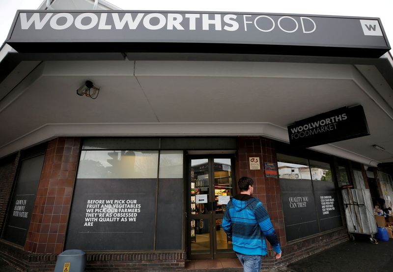 &copy; Reuters. FILE PHOTO: A man walks past an outlet of retailer Woolworths in Cape Town, South Africa, June 19, 2017. REUTERS/Mike Hutchings/File Photo