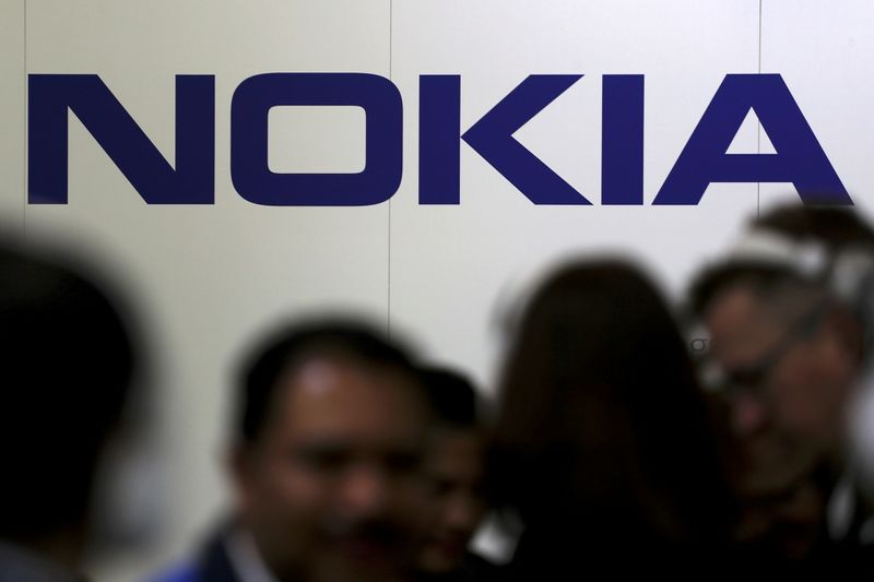 &copy; Reuters. FILE PHOTO: Visitors gather outside the Nokia booth at the Mobile World Congress in Barcelona, Spain, February 26, 2019. REUTERS/Sergio Perez
