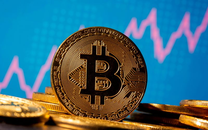 &copy; Reuters. FILE PHOTO: A representation of virtual currency bitcoin is seen in front of a stock graph in this illustration taken November 19, 2020. REUTERS/Dado Ruvic/Illustration