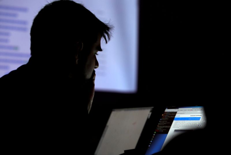 &copy; Reuters. FILE PHOTO: A man takes part in a hacking contest during the Def Con hacker convention in Las Vegas, Nevada, U.S. on July 29, 2017. REUTERS/Steve Marcus
