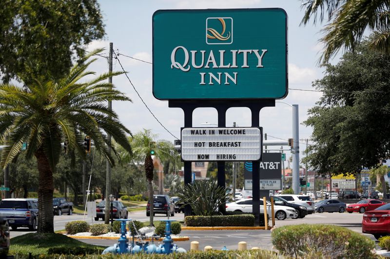 &copy; Reuters. FILE PHOTO: A Quality Inn hotel displays a "Now Hiring" sign in Tampa, Florida, U.S., June 1, 2021.  REUTERS/Octavio Jones/File Photo