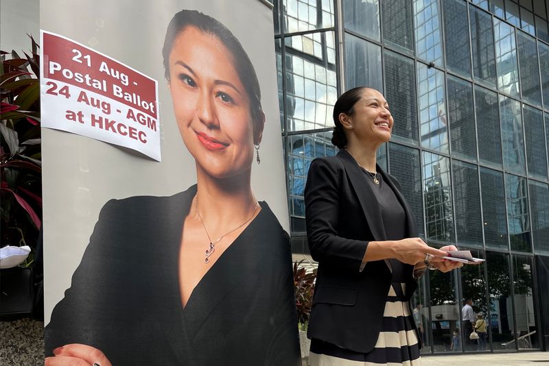 &copy; Reuters. FILE PHOTO: Selma Masood, a candidate for the Hong Kong Law Society's election to select new council members, hands out pamphlets outside the city's district court ahead of the election in Hong Kong, China August 12, 2021. REUTERS/James Pomfret