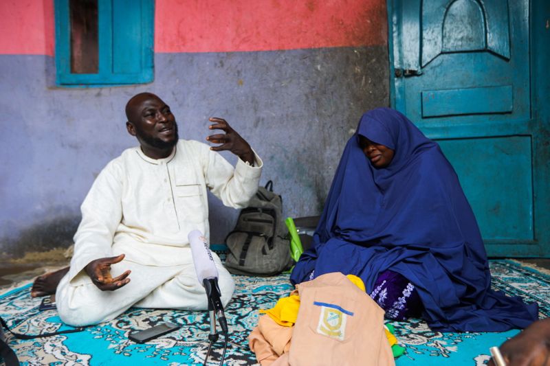 &copy; Reuters. Abubakar Adam and wife, parents of seven children kidnapped at Salihu Tanko Islamic school by bandits, speak during an interview with Reuters at their house in Tegina, Niger State, Nigeria August 11, 2021.  REUTERS/Afolabi Sotunde