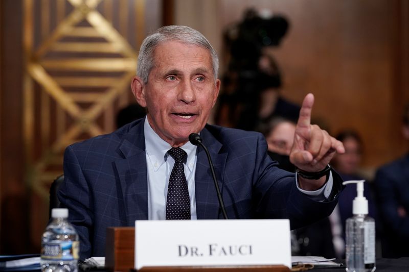 &copy; Reuters. FILE PHOTO: Top infectious disease expert Dr. Anthony Fauci responds to accusations by Sen. Rand Paul (R-KY) as he testifies before the Senate Health, Education, Labor, and Pensions Committee on Capitol hill in Washington, D.C., U.S., July 20, 2021.  J. S