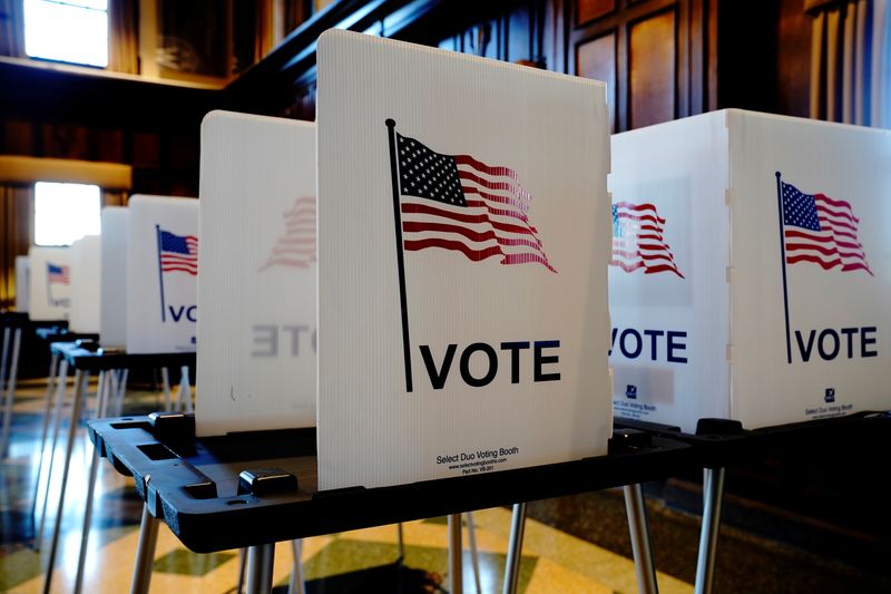 &copy; Reuters. FILE PHOTO: Unused privacy booths are seen at a voting site in Tripp Commons inside the Memorial Union building on the University of Wisconsin-Madison campus on Election Day in Madison, Dane County, Wisconsin, U.S. November 3, 2020. REUTERS/Bing Guan/File