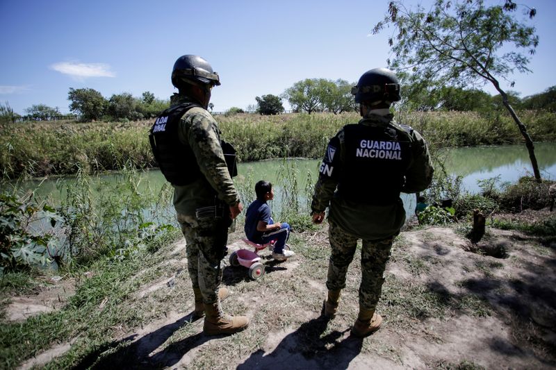 © Reuters. FILE PHOTO: A migrant boy, an asylum seeker sent back to Mexico from the U.S. under the 