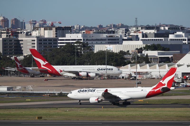 &copy; Reuters. Qantas planes are seen at Kingsford Smith International Airport, following the coronavirus outbreak, in Sydney, Australia, March 18, 2020.  REUTERS/Loren Elliott