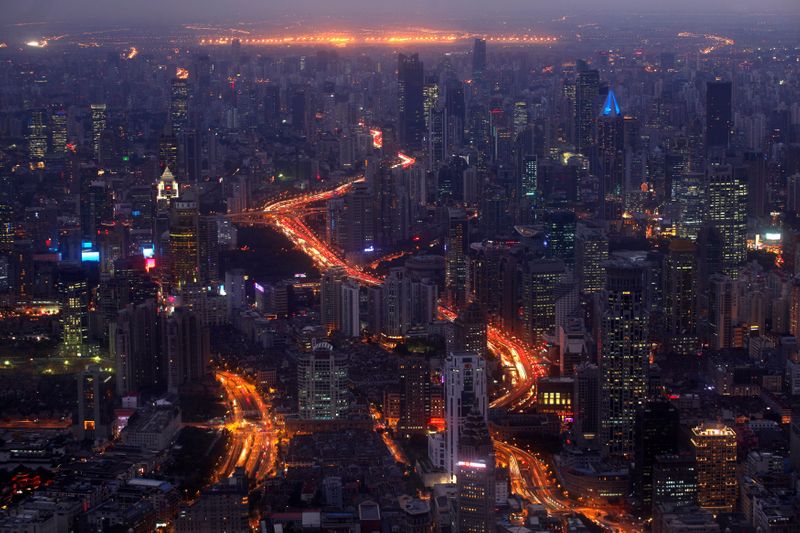 &copy; Reuters. FILE PHOTO: A view of the city skyline from the Shanghai Financial Center building, October 25, 2011. REUTERS/Carlos Barria