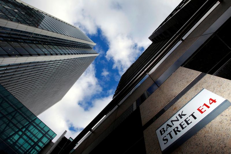&copy; Reuters. FILE PHOTO: A sign for Bank Street and high rise offices are seen in the financial district in Canary Wharf in London, Britain, October 21, 2010.   REUTERS/Luke Macgregor