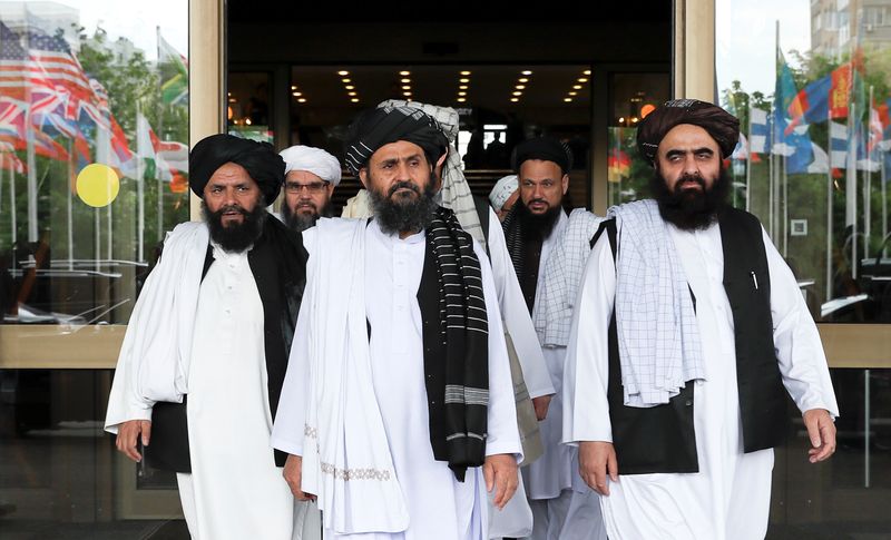 &copy; Reuters. Members of a Taliban delegation, led by chief negotiator Mullah Abdul Ghani Baradar (C, front), leave after peace talks with Afghan senior politicians in Moscow, Russia May 30, 2019. REUTERS/Evgenia Novozhenina