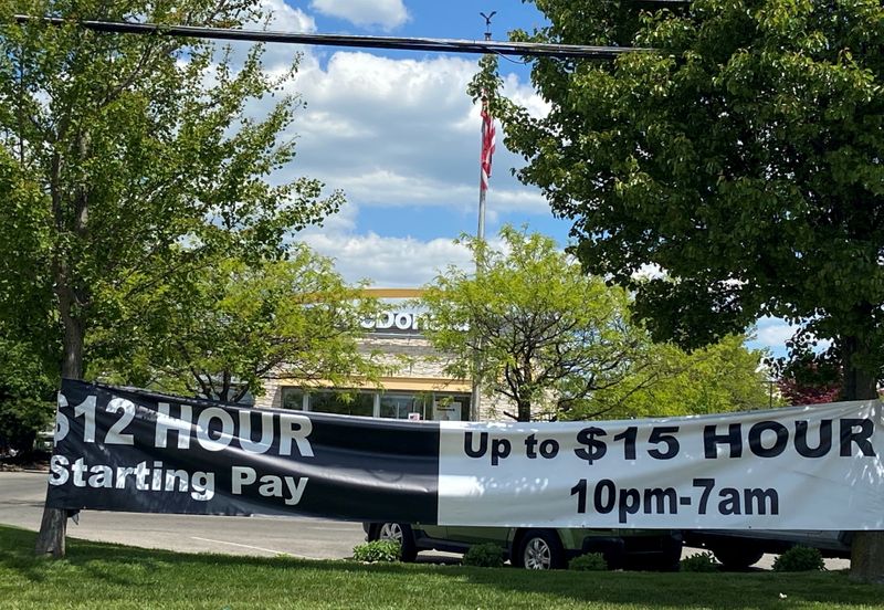 &copy; Reuters. FILE PHOTO: A banner inviting people to apply for open jobs is seen outside a McDonald's restaurant in Bloomington, Indiana, U.S., May 14, 2021. . REUTERS/Nick Zieminski/File Photo/File Photo