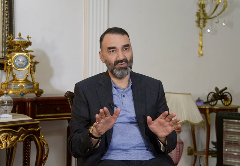 &copy; Reuters. FILE PHOTO: Atta Mohammad Noor, Governor of the Balkh province, gestures as he speaks during an interview in Mazar-i-Sharif, Afghanistan January 1, 2018. REUTERS/Anil Usyan/File Photo/File Photo