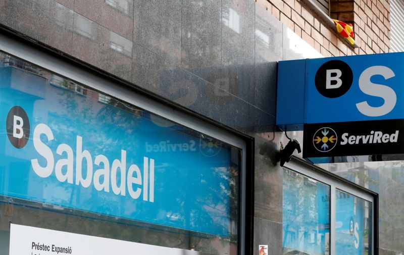 &copy; Reuters. FILE PHOTO: A Catalan flag is seen above a logo at the Sabadell bank branch in Barcelona, Spain October 6, 2017. REUTERS/Yves Herman/File Photo