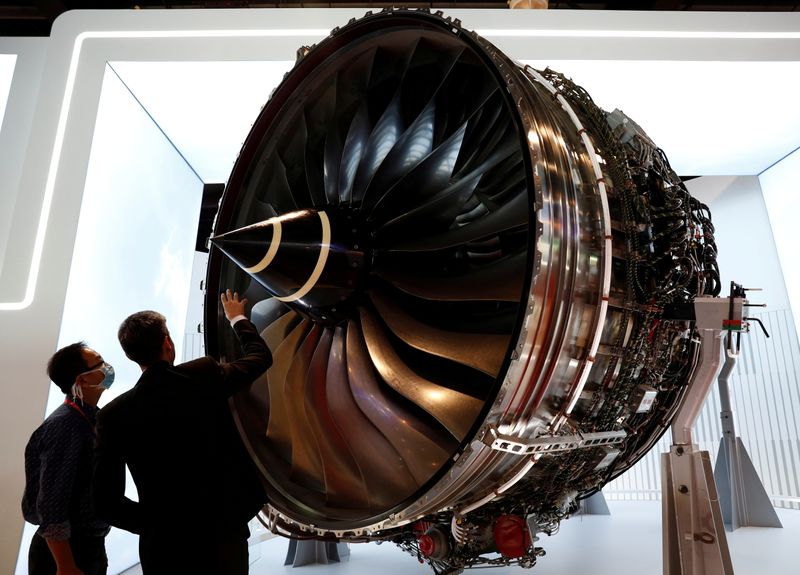 &copy; Reuters. FILE PHOTO: People look at Rolls Royce's Trent Engine displayed at the Singapore Airshow in Singapore February 11, 2020. REUTERS/Edgar Su