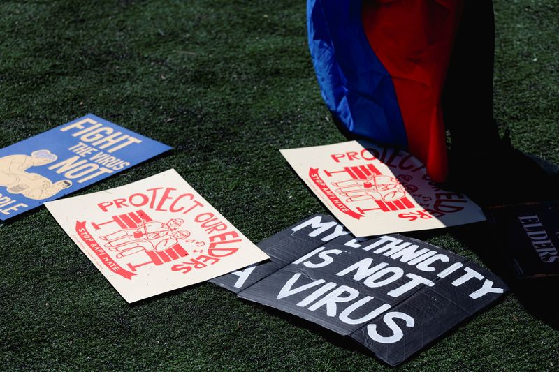 © Reuters. FILE PHOTO: Signs are spread on the ground during a Rally Against Hate to end discrimination against Asian Americans and Pacific Islanders in New York City, U.S., March 21, 2021. REUTERS/Eric Lee