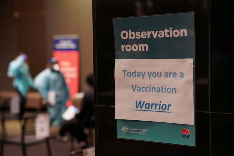 © Reuters. FILE PHOTO: A motivational sign is seen inside a coronavirus disease (COVID-19) vaccination clinic at the Bankstown Sports Club during a lockdown to curb an outbreak of cases in Sydney, Australia, August 25, 2021.  REUTERS/Loren Elliott/File Photo
