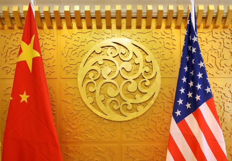 &copy; Reuters. FILE PHOTO: Chinese and U.S. flags are set up for a meeting at China's Ministry of Transport in Beijing, China April 27, 2018. REUTERS/Jason Lee