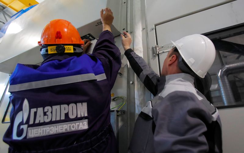 &copy; Reuters. Gazprom employees adjust equipment at the Atamanskaya compressor station, facility of Gazprom's Power Of Siberia gas pipeline outside the far eastern town of Svobodny, in Amur region, Russia November 29, 2019. Picture taken November 29, 2019. REUTERS/Maxi