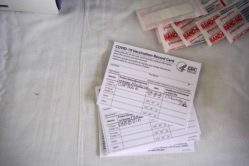 &copy; Reuters. FILE PHOTO: Vaccination cards are pictured at a rural coronavirus disease (COVID-19) vaccination site in Columbus, New Mexico, U.S., April 16, 2021.  REUTERS/Paul Ratje/File Photo