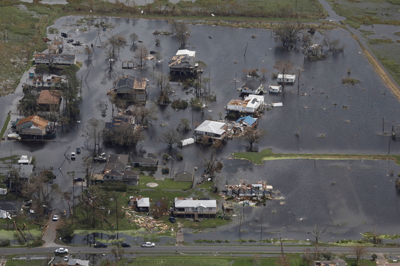 &copy; Reuters. FILE PHOTO: An aerial view shows destroyed houses in a flooded area after Hurricane Ida made landfall in Louisiana, in Montegut, Louisiana, U.S. August 31, 2021. REUTERS/Marco Bello