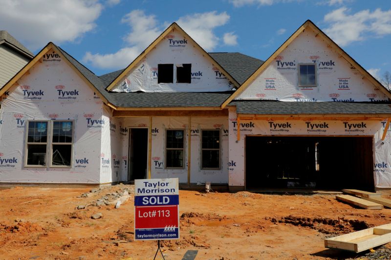 &copy; Reuters. FILE PHOTO: A home under construction stands behind a "sold" sign in a new development in York County, South Carolina, U.S., February 29, 2020. REUTERS/Lucas Jackson/File Photo