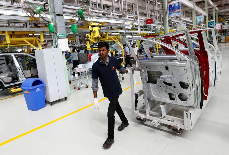 &copy; Reuters. FILE PHOTO: An employee works inside the Mahindra & Mahindra manufacturing plant in Chakan, India, September 30, 2016. REUTERS/Danish Siddiqui/File Photo