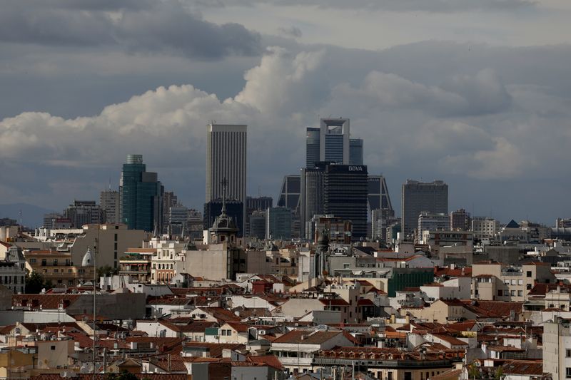 &copy; Reuters. FILE PHOTO: Clouds pass over business district buildings in Madrid, Spain June 4, 2018. REUTERS/Sergio Perez