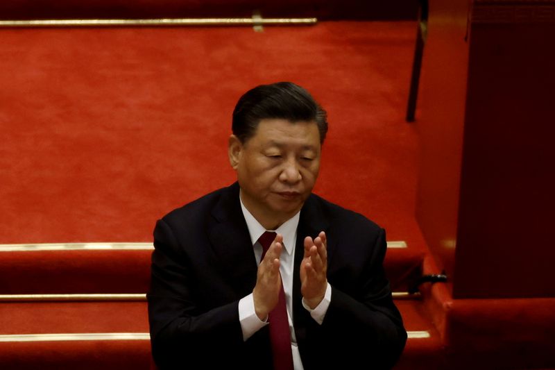 &copy; Reuters. FILE PHOTO: Chinese President Xi Jinping applauds at the opening session of the National People's Congress (NPC) at the Great Hall of the People in Beijing, China March 5, 2021. REUTERS/Carlos Garcia Rawlins//File Photo