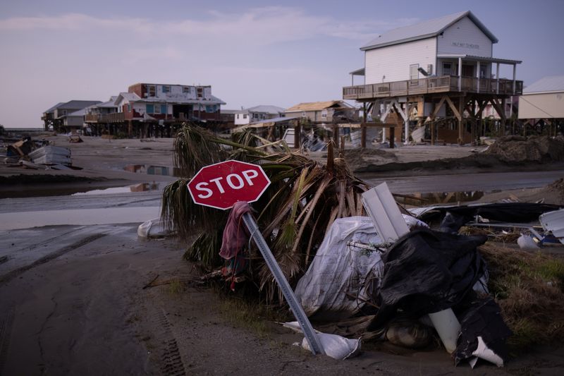 &copy; Reuters. A stop sign lies damaged at a street corner in the aftermath of Hurricane Ida in Grand Isle, Louisiana, U.S., September 2, 2021.  REUTERS/Adrees Latif