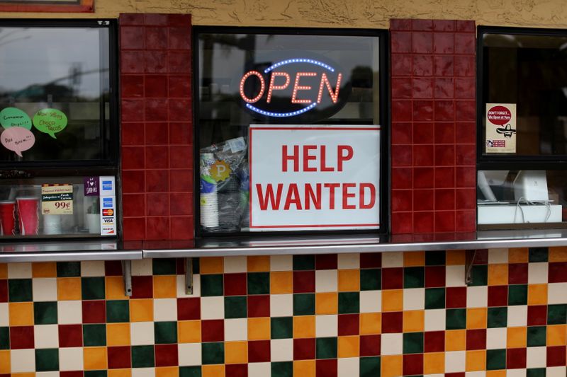&copy; Reuters. FILE PHOTO: A help wanted sign is posted at a taco stand in Solana Beach, California, U.S., July 17, 2017.   REUTERS/Mike Blake/File Photo