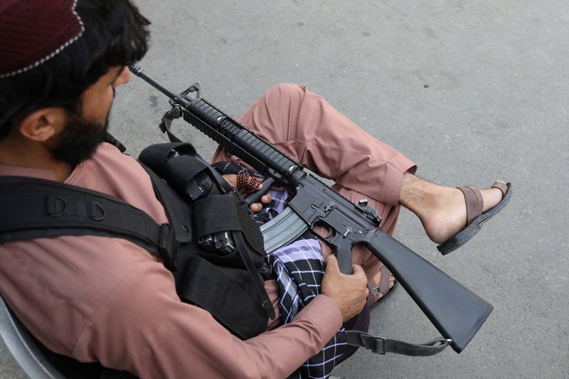 &copy; Reuters. A member of the Taliban sits while holding his gun in Kabul, Afghanistan, September 4, 2021. WANA (West Asia News Agency) via REUTERS 