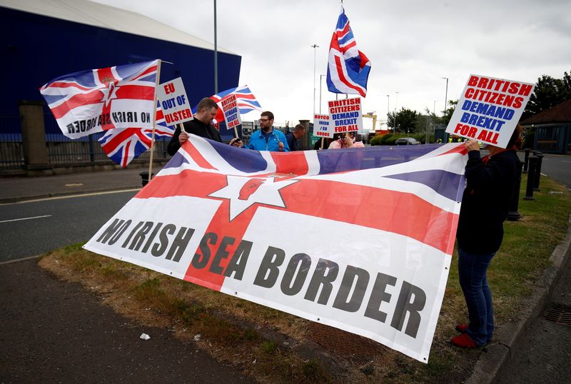 &copy; Reuters. FILE PHOTO: Loyalists protest against the Northern Ireland Brexit protocol at Belfast Harbour Estate, in Belfast, Northern Ireland, July 3, 2021. REUTERS/Jason Cairnduff