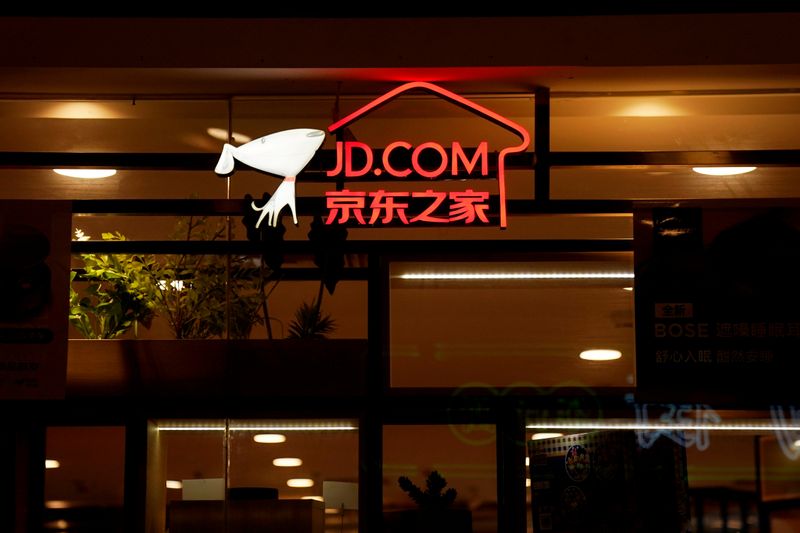 &copy; Reuters. FILE PHOTO: A sign of China's e-commerce company JD.com is seen at its shop at a mall in Shanghai, China October 26, 2018. REUTERS/Aly Song/File Photo
