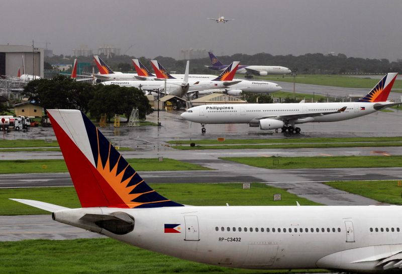 &copy; Reuters. FILE PHOTO: Philippine Airlines (PAL) planes are seen parked on tarmac in Manila International Airport in Pasay city, metro Manila September 9, 2014. REUTERS/Romeo Ranoco/File Photo