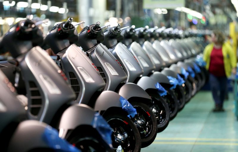 &copy; Reuters. Piaggio's Vespa scooters are seen at the Pontedera's farm, Italy, April 19, 2018. REUTERS/Alessandro Bianchi/Files