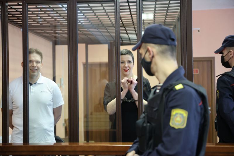 &copy; Reuters. Belarusian opposition figures Maria Kolesnikova and Maxim Znak, charged with extremism and trying to seize power illegally, react inside a defendants' cage as they attend a court hearing in Minsk, Belarus September 6, 2021. Ramil Nasibulin/BelTA/Handout v